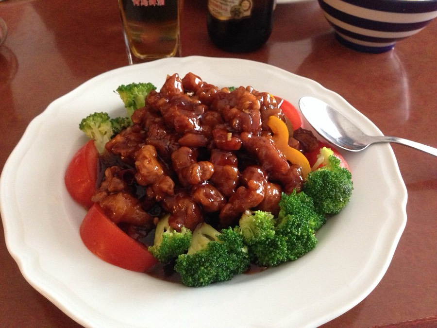 Crispy chicken in a dark, glossy sauce with broccoli